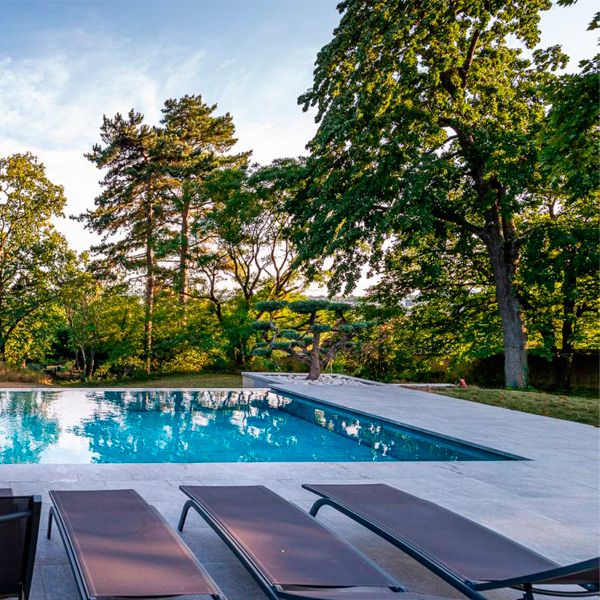 stylish infinity pool with mobile floor, by Côté Jardin