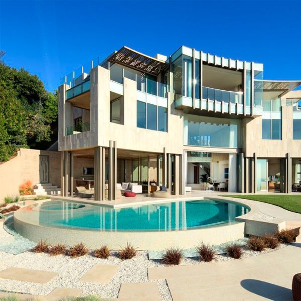 custom infinity pool with built-in spa, in a project by Landry Design Group