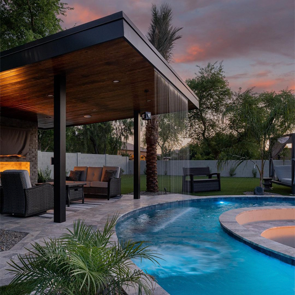 water curtain in an outdoor living space with a great pool by Sherwood Outdoors