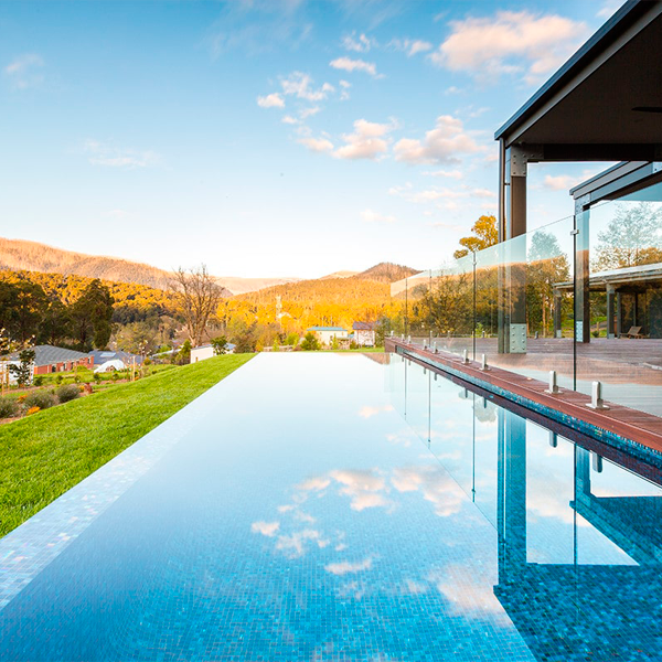 above ground infinity pool with spa by Aquacon Pools