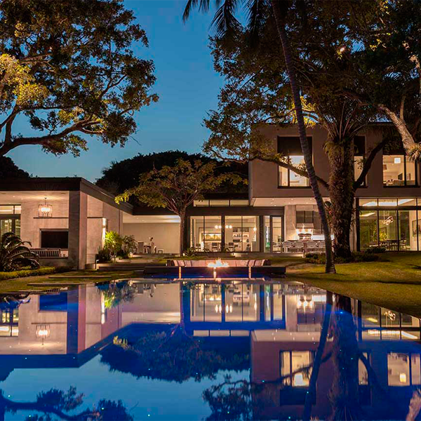 infinity pool and spa at night, by Pool Tech of Miami