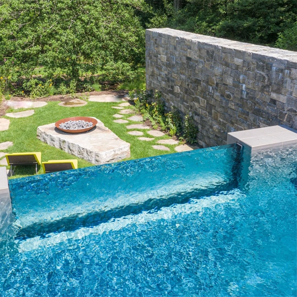 infinity pool with transparent window by Drakeley Pools
