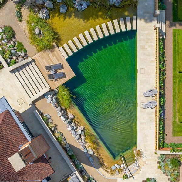 Drone view of a beautiful natural pool, exclusive geometric designed by Gartenart, in a country house