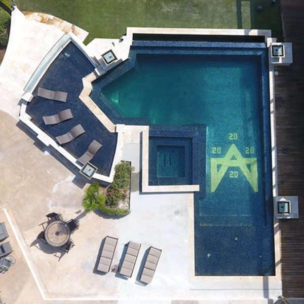 infinity pool and spa drone view by Pinnacle Exterior Construction