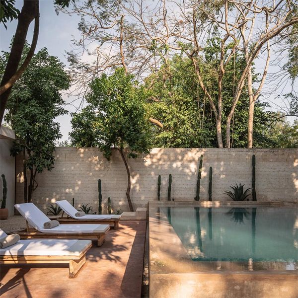 Chic outdoor space with infinity pool in a boutique hotel project by Collectif Como