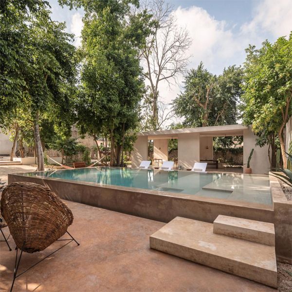 elegant infinity pool in a chic boutique hotel project by Collectif Como