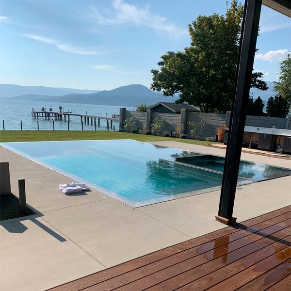 stainless steel infinity pool, mirror effect, with built-in spa, by Pure Stainless Pools
