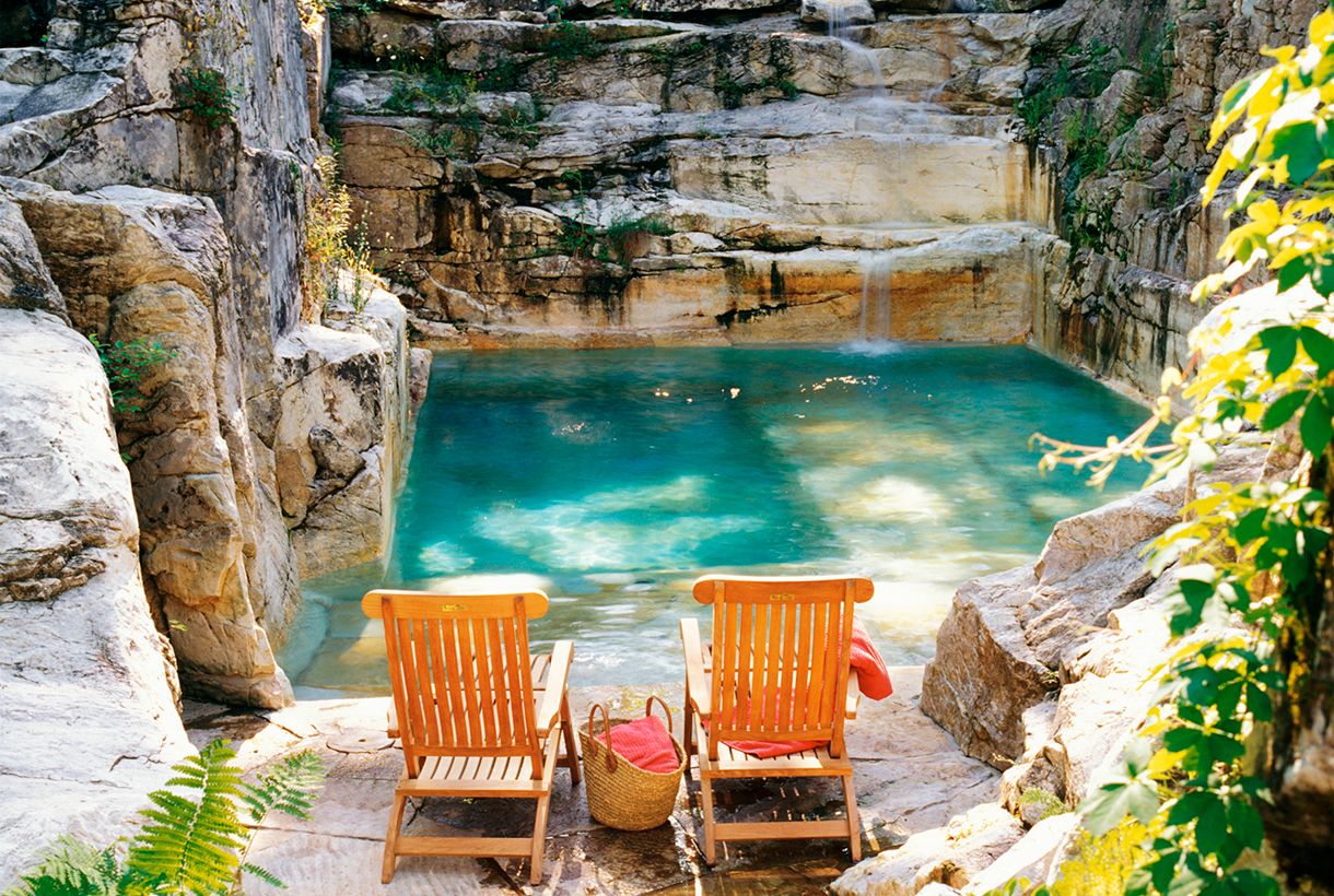 example of a sustainable and efficient pool carved into the rock
