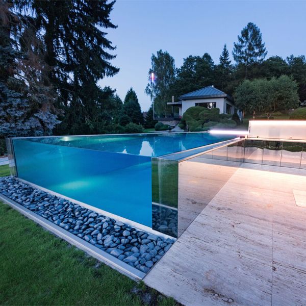 a unique transparent infinity pool at night, by Imaginox