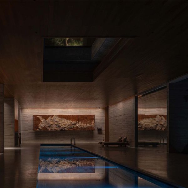 minimalist indoor lap pool, in a luxury project by More Than Arch Studio