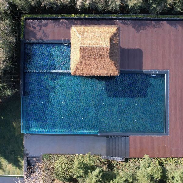 drone view of a transparent infinity pool, by Aupool