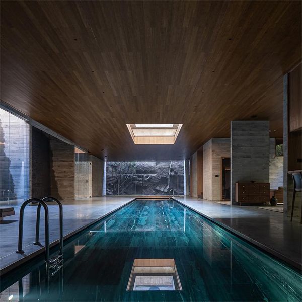 minimalist indoor lap pool, in a luxury project by More Than Arch Studio