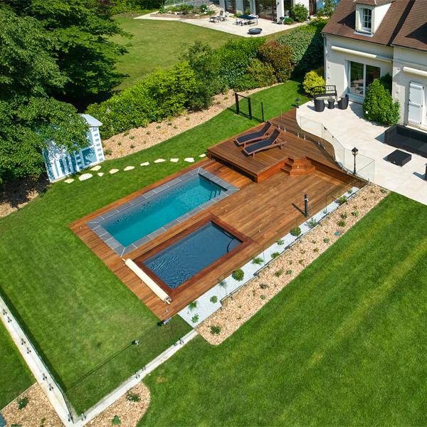 vue drone de deux mini piscines entourées d'une terrasse en bois par Henocque Piscines